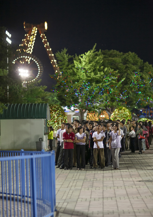 North Korean people queueing in Kaeson youth parkfun fair, DGC, Pyongyang, North Korea