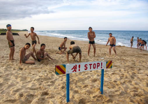 Group of North Korean boys playing at the beach, North Hamgyong, Chilbo Sea, North Korea