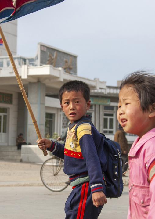 Children parading in the streets on the international workers' day, Kangwon Province, Wonsan, North Korea