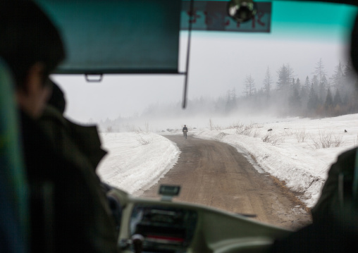 Bus on a snowy road, Ryanggang, Rimyongsu, North Korea