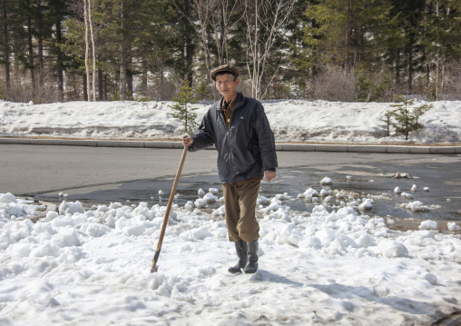 North Korean man walking on an icy road in the countryside, Ryanggang, Samjiyon, North Korea