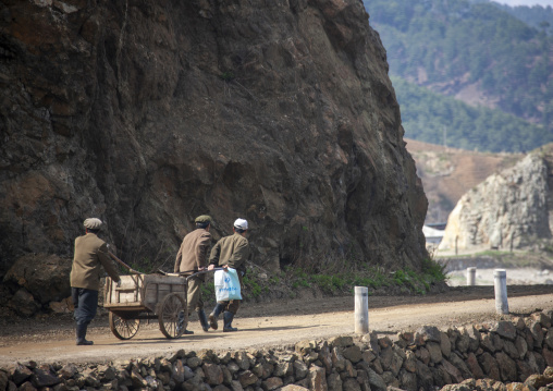 North Korean men pulling a cart, North Hamgyong, Jung Pyong Ri, North Korea