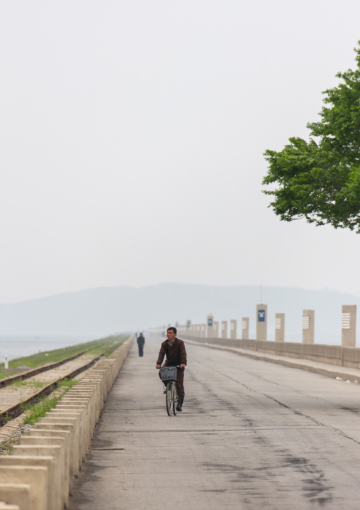 Cyclist on the West sea dam, South Pyongan, Nampo, North Korea