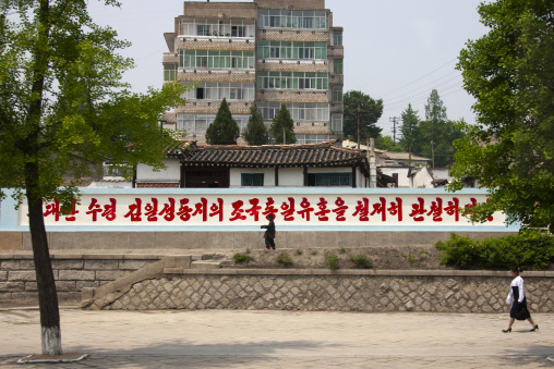 Buildings in a residential district with a propaganda billboard, North Hwanghae, Kaesong, North Korea
