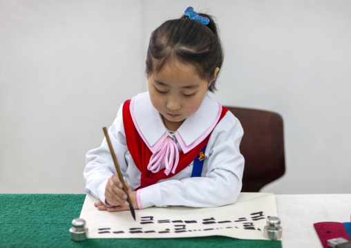 Pioneer girl in a calligraphy workshop in Mangyongdae children's palace, DGC, Pyongyang, North Korea