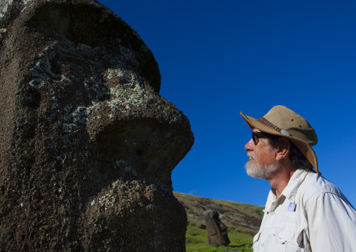 Edmundo edwards in front of a moai in rano raraku, Easter Island, Hanga Roa, Chile