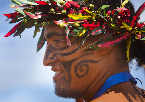 Man with traditional headdress and make up in tapati festival, Easter Island, Hanga Roa, Chile