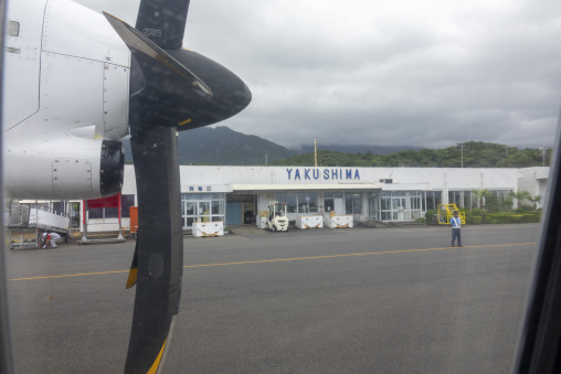 Airplane propeller framing the Yakushima airport terminal buildi