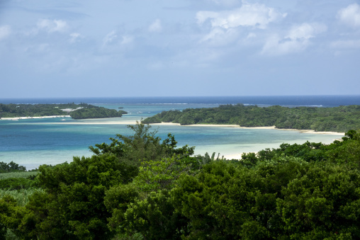 Elevated view of a turquoise lagoon and sandy coastline, Yaeyama
