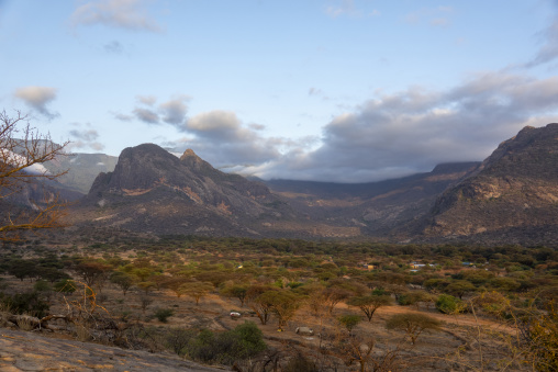 Rugged mountains tower over a hidden valley near the Rendille tribe village, Marsabit District, Ngurunit, Kenya