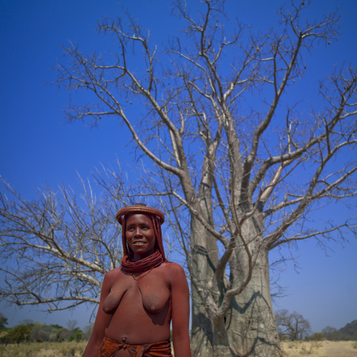 Himba Woman In Front Of A Baobab Tree, Angola