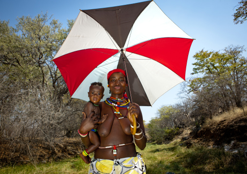 Mudimba Woman With Her Baby Under An Umbrella, Angola
