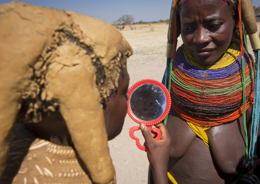 Mumuhuila Girl Looking At Herself In A Hand Mirror, Hale Village, Angola