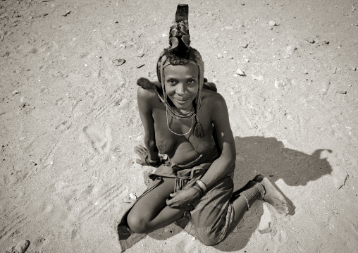 Himba Woman Sitting On The Ground, Iona Village, Angola