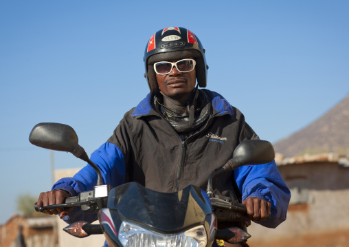 Himba With A Helmet And Sunglasses On A Motorbike, Village Of Oncocua, Angola