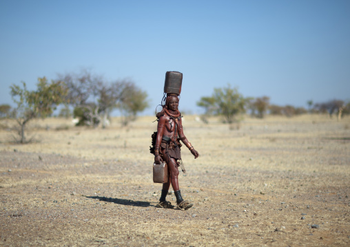 Muhimba Woman Carrying Jerrycans, Village Of Elola, Angola