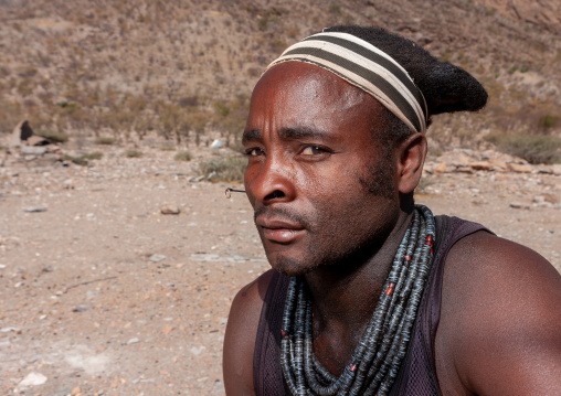 Himba tribe man with the traditional necklace, Cunene Province, Oncocua, Angola