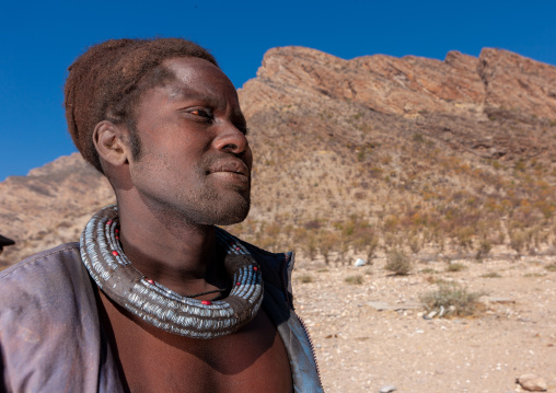 Himba tribe man with the traditional necklace, Cunene Province, Oncocua, Angola