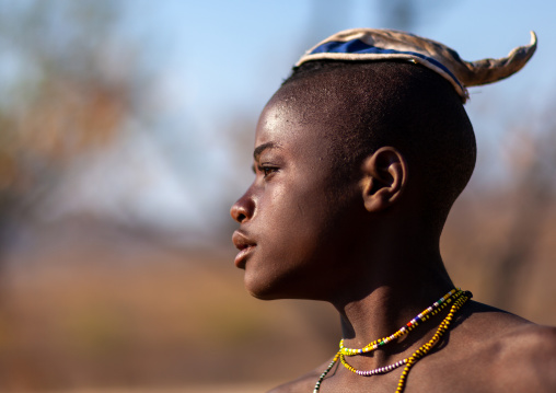 Portrait of a single Himba tribe young man, Cunene Province, Oncocua, Angola