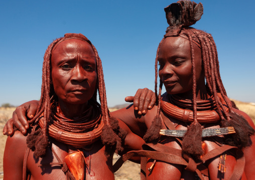 Himba tribe women covered with otjize, Cunene Province, Oncocua, Angola