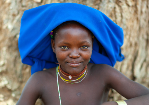 Mucubal tribe young woman wearing a blue headwear, Namibe Province, Virei, Angola