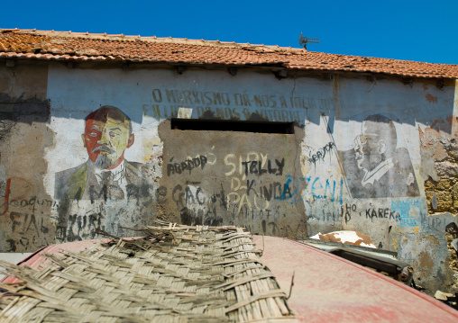 Old communist propaganda painted on a wall with lenin and jose eduardo dos santos, Namibe Province, Namibe, Angola