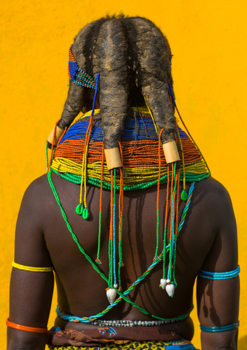 Rear view of a Mumuhuila tribe woman, Huila Province, Chibia, Angola