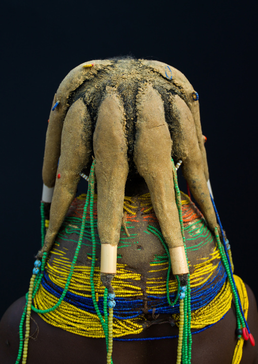 Rear view of a Mumuhuila tribe woman, Huila Province, Chibia, Angola