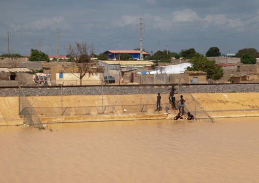 Angolan children having a bath in a canal in the city, Luanda Province, Luanda, Angola