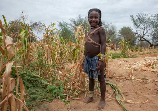 Mucubal tribe girl in a corn field, Namibe Province, Virei, Angola