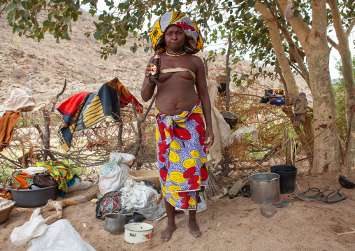 Mucubal tribe woman drinking a beer, Namibe Province, Virei, Angola