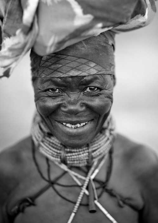 Old Mugambue Woman  Carrying A Bundle On Her Head, Angola