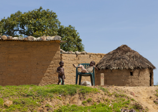 Kids Playing In Front Of Huts In Lubango, Angola