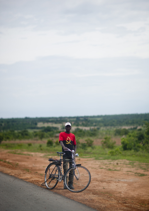 Man With A Bike Wearing A Tee Shirt With The National Flag Colours, Angola