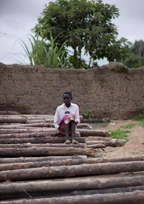 Boy Sitting On Wood, Huambo, Angola