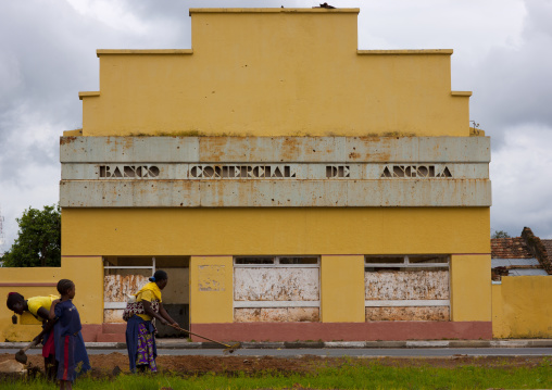 Women Ploughing In Front Of An Old Bank In Ruins, Vila Nova, Angola