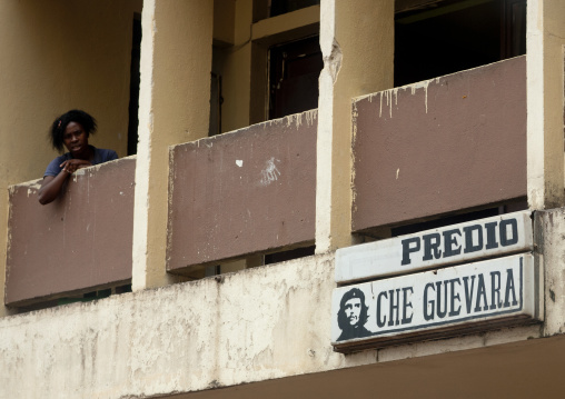 Woman On The Balcony Of A Dilapidated Hotel In Malanje, Angola