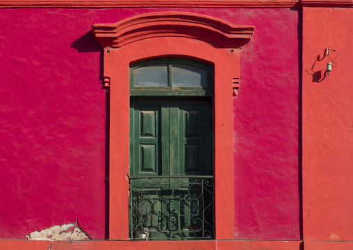 Red Facade Of An Old Colonial House In Luanda, Angola