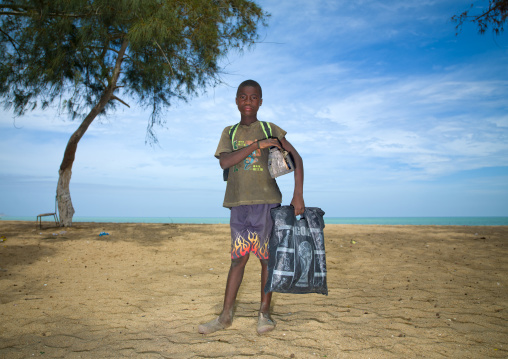 Boy On The Beach Holding A Plastic Bag, Benguela, Angola