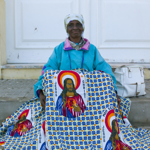 Woman With Headband Selling A Loincloth Decorated With The Head Of Jesus, Namibe Town, Angola