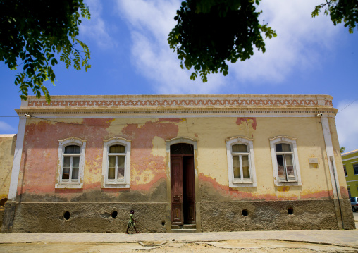 Girl Passing By A Colonial Building In Namibe Town, Angola