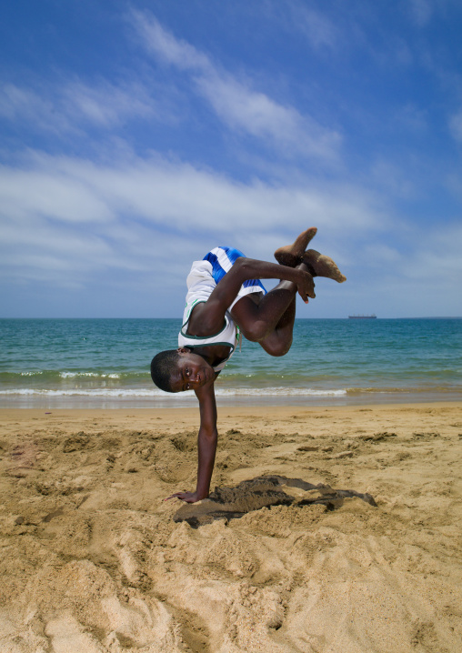 Boy Dancing Capoeira On The Beach, Angola