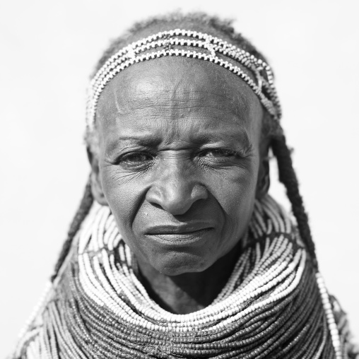 Old Mwila Woman With Vilanda Necklace And Traditional Hairstyle, Angola