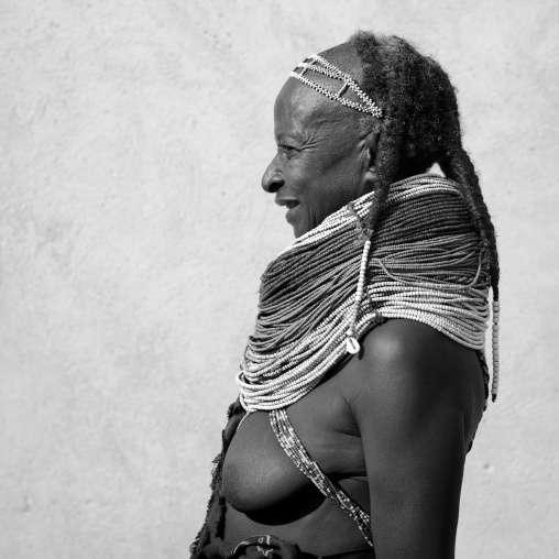 Old Mwila Woman With Vilanda Necklace And Traditional Hairstyle, Angola