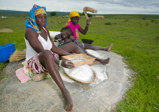 Women And Girl Grinding Grain, Village Of Caconda, Angola