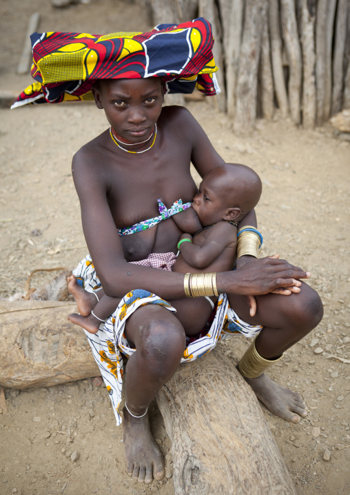 Mucubal Woman With Ompota Headdress Breast Feeding Her Baby, Virie Area, Angola