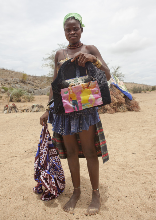 Mucubal Woman Using A Barbie Package To Make Her Ompota Headdress, Virie Area, Angola