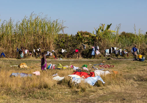 Women washing clothes in the bush, Huila Province, Chibia, Angola