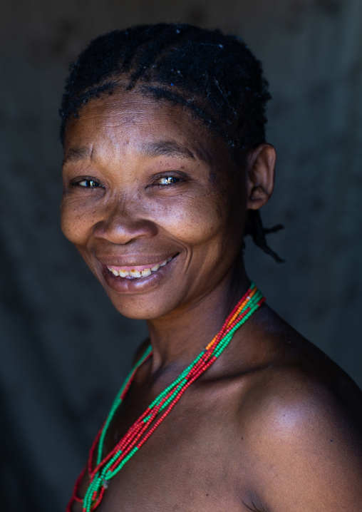 San tribe woman smiling portrait, Huila Province, Chibia, Angola
