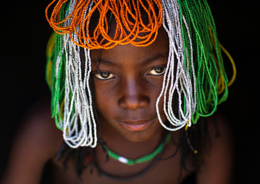Muhakaona tribe girl with a beaded wig used for the fico ceremony, Cunene Province, Oncocua, Angola